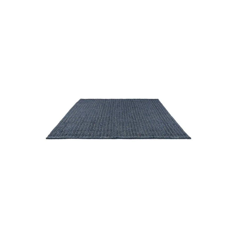 Brink & Campman Craft Plait Denim Designer Rug featuring plaited pattern in denim blue, navy and indigo on white background, hand-loomed wool
