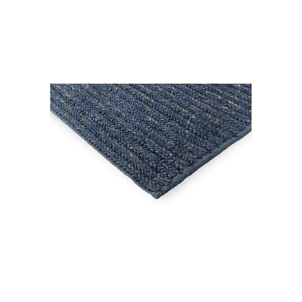 Brink & Campman Craft Plait Denim Rug featuring braided plait pattern in navy denim with beige specks on off-white background, hand-woven wool
