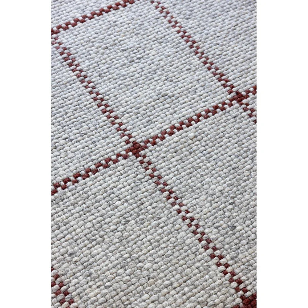 Brink & Campman Craft Matter Check Ash Rug featuring check pattern in ash grey & burgundy on light background, hand-tufted wool