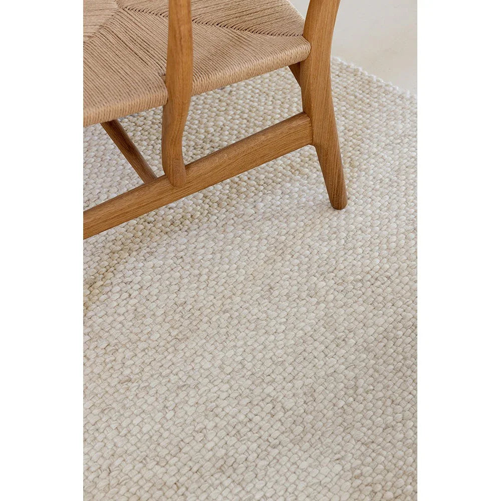 Brink & Campman Craft Matter Rug featuring plain woven texture in warm white/cream on ivory background, hand-tufted wool