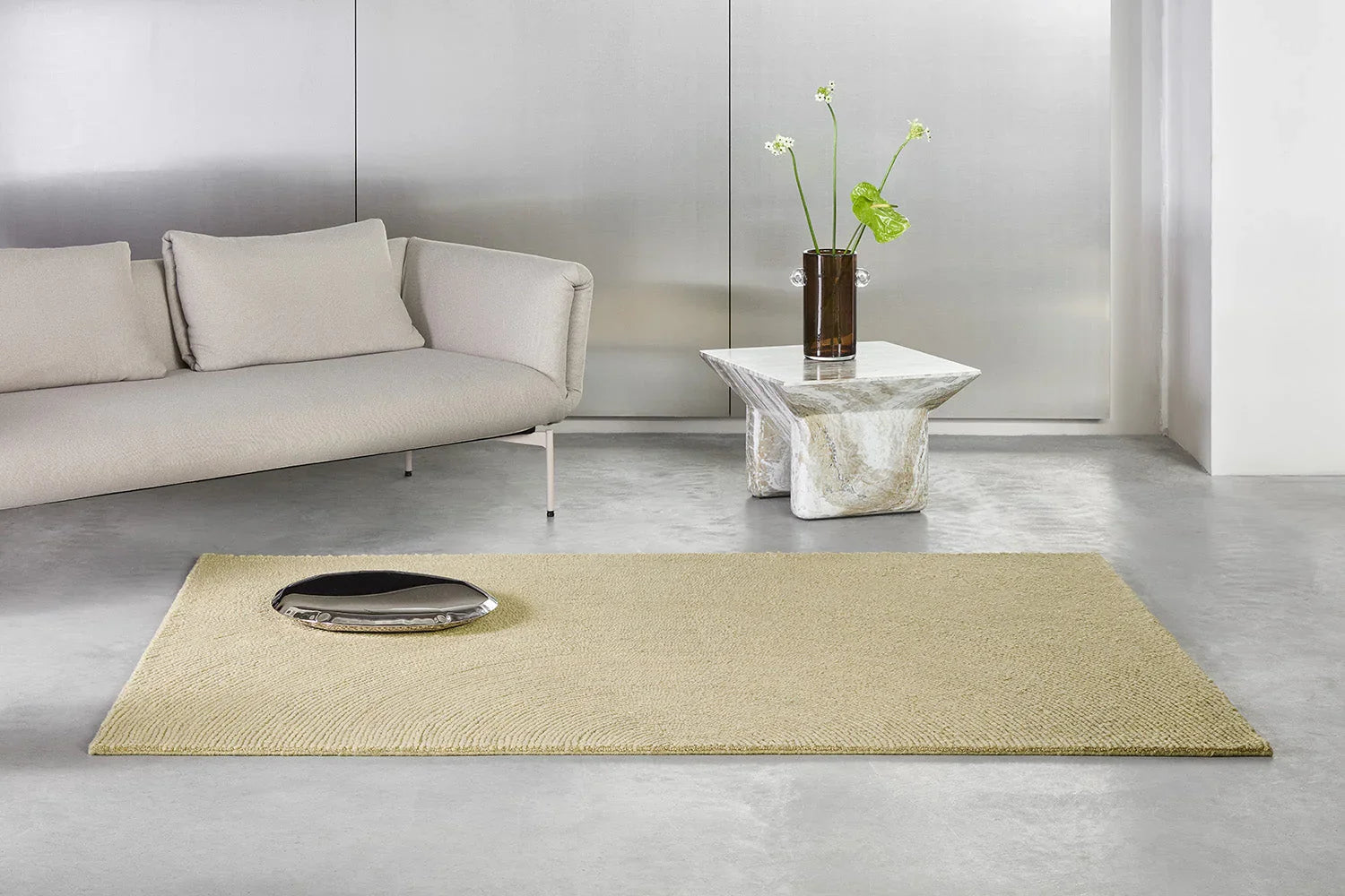 B&C Decor Echo Sand Designer Rug featuring solid textured weave in sand beige and ivory on grey background, hand-tufted wool