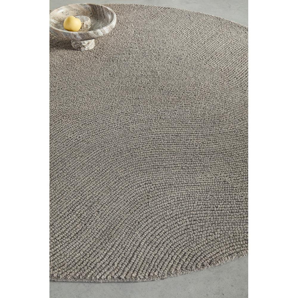 B&C Decor Echo Pebble Round Rug featuring pebble-textured boucle in taupe and cream on grey background, woven wool blend