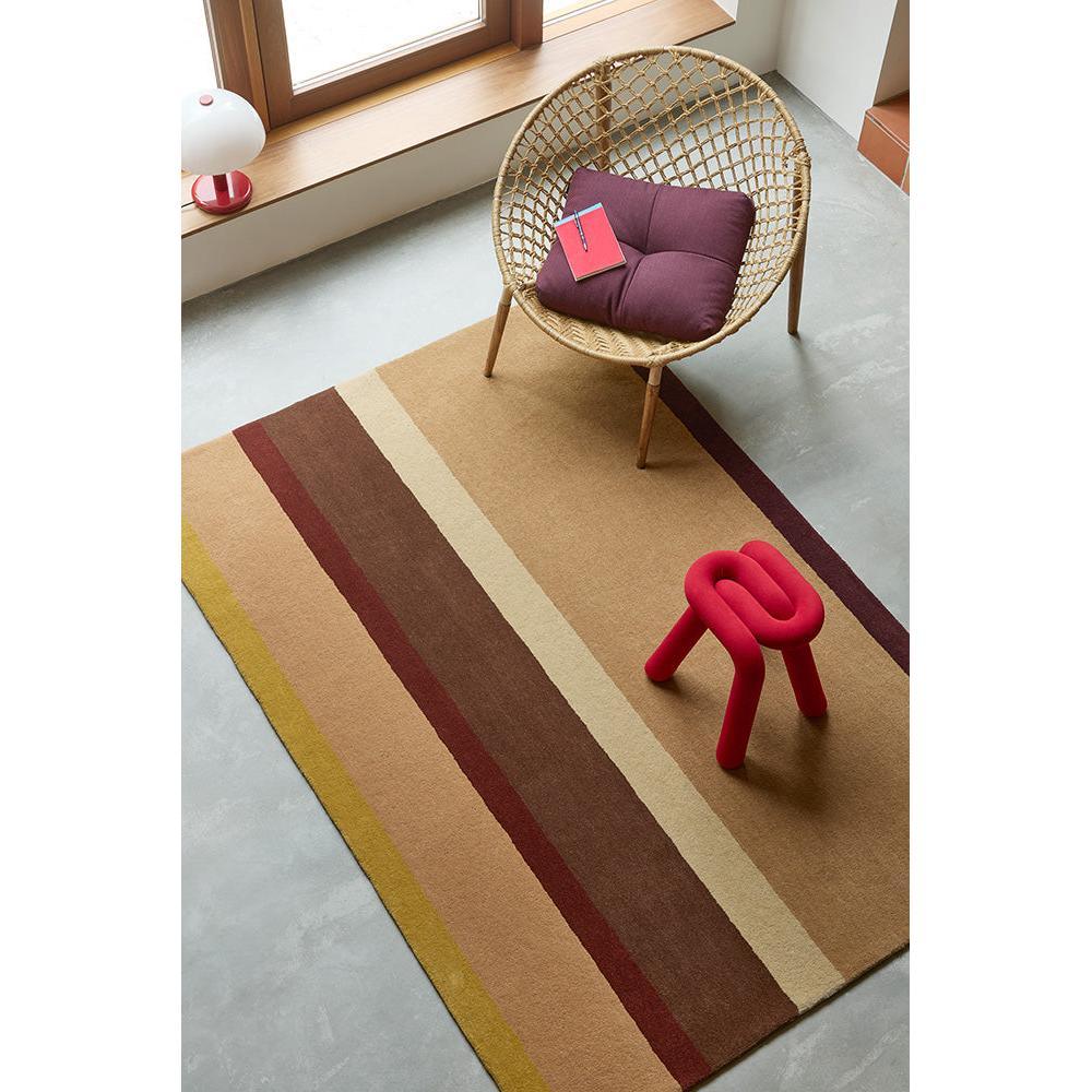 B&C Decor Linear Ruby Designer Rug featuring linear stripe pattern in mustard yellow, tan, beige, brown and burgundy on camel background, hand-tufted wool