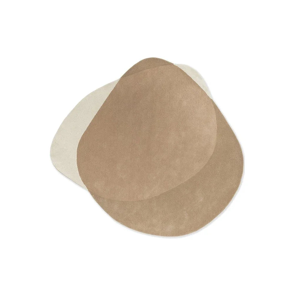 Brink & Campman Element Arp Natural Rug featuring abstract overlapping ovals in cream, beige and taupe on natural backdrop, hand-tufted wool