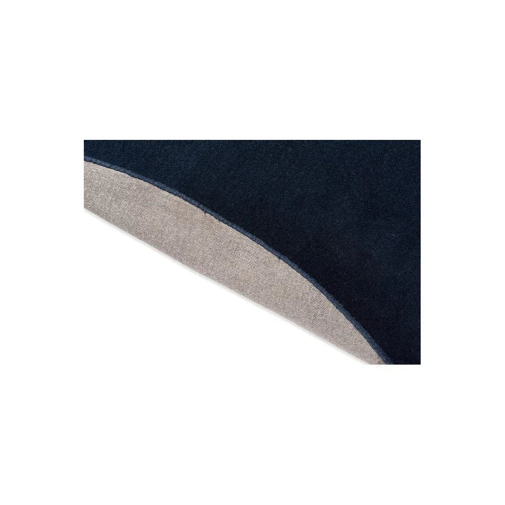 Brink & Campman Element Arp Blue Designer Rug featuring curved navy and beige blocks on light backdrop, hand-tufted wool