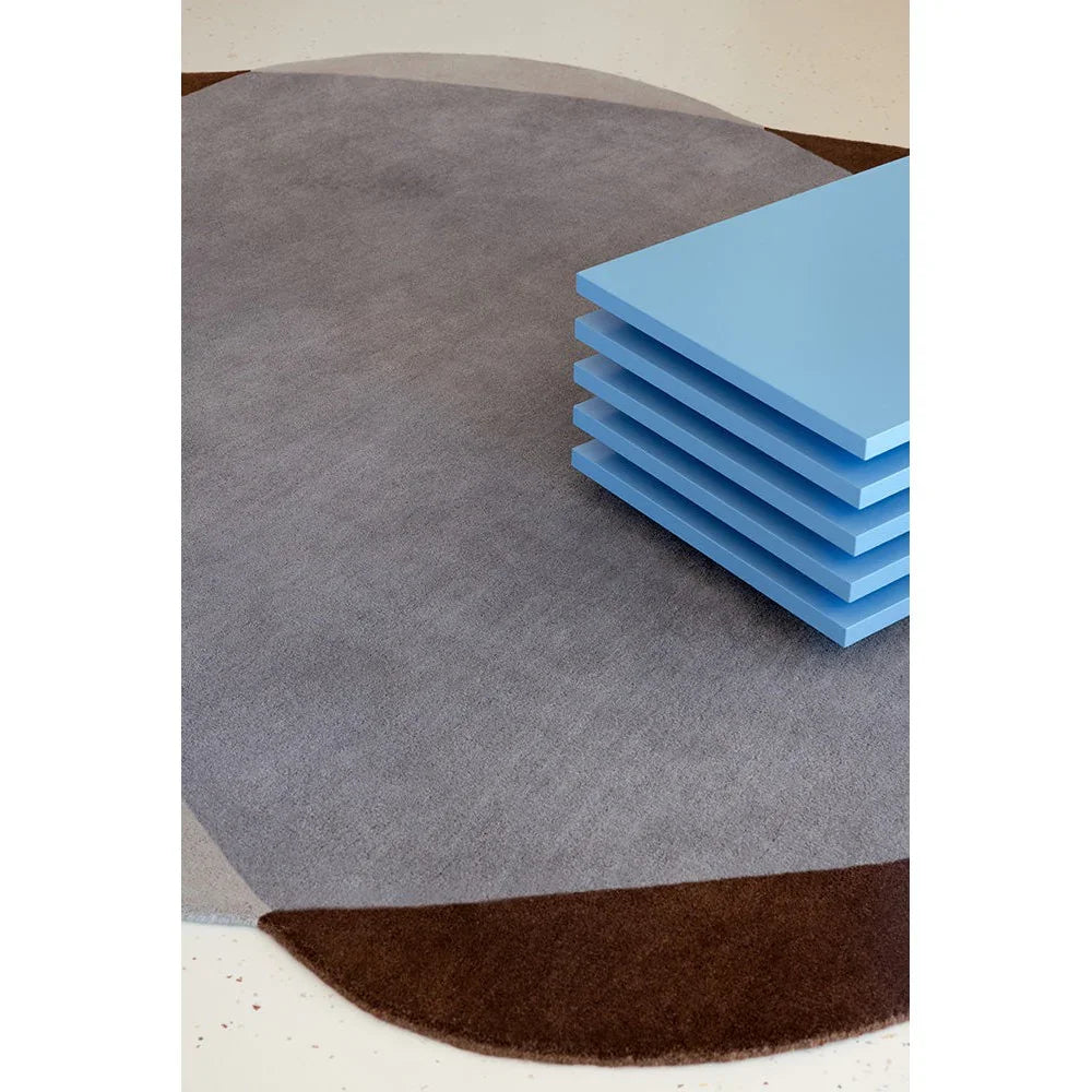 Brink & Campman Element Chad Brown Blue Rug featuring abstract pattern in brown, grey and blue on cream background, hand-tufted wool
