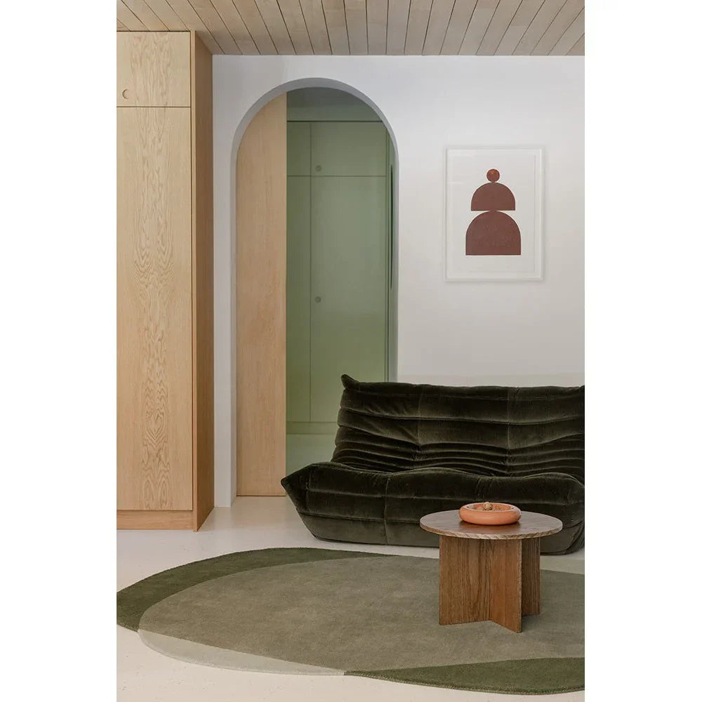 Brink & Campman Element Moore Moss Designer Rug featuring abstract circular motif in moss green, olive and beige on cream background, hand-tufted wool