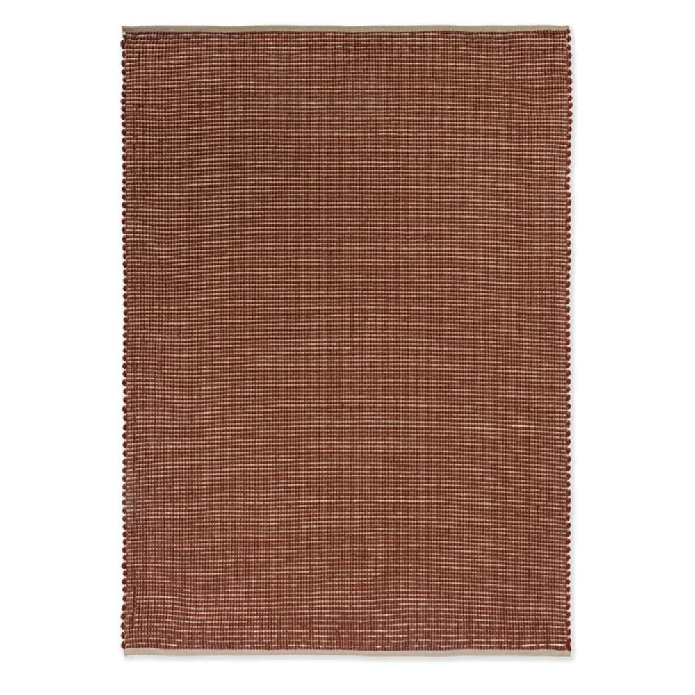 Brink & Campman Frame Brick Designer Rug featuring subtle grid pattern in brick red, brown and cream on ivory background, hand-tufted wool