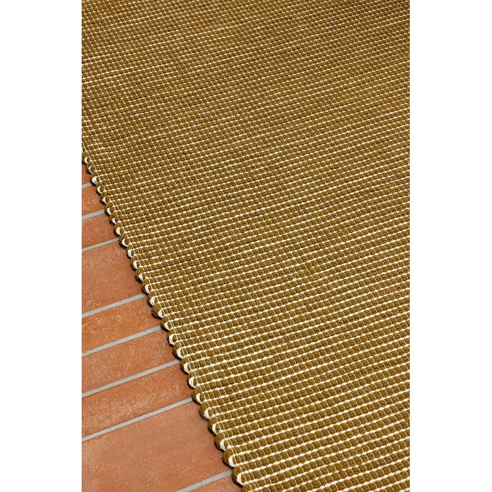 Brink & Campman Frame Mustard Designer Rug featuring grid pattern in mustard and ivory on warm terracotta background, machine-woven wool