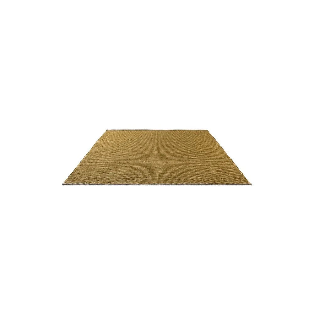 Brink & Campman Frame Mustard Designer Rug featuring solid mustard colour in plain weave on white background, machine-made wool
