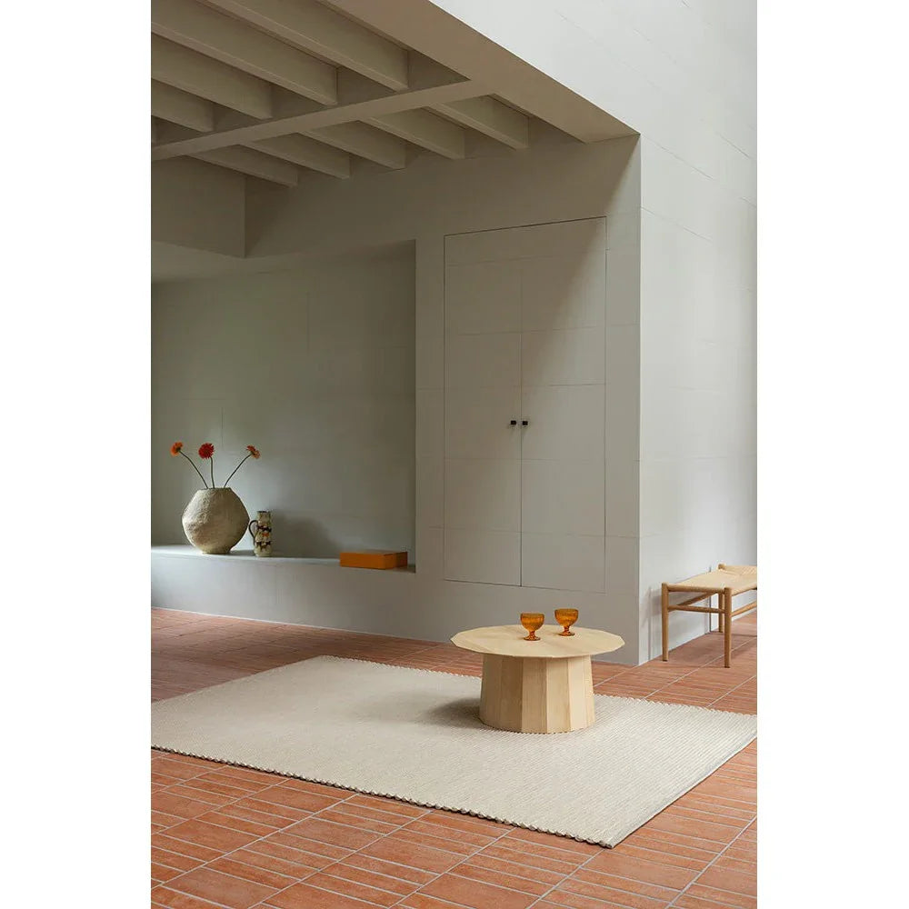 Brink & Campman Frame Natural Rug featuring minimalist frame pattern in cream, ivory on light gray backdrop, hand-tufted wool