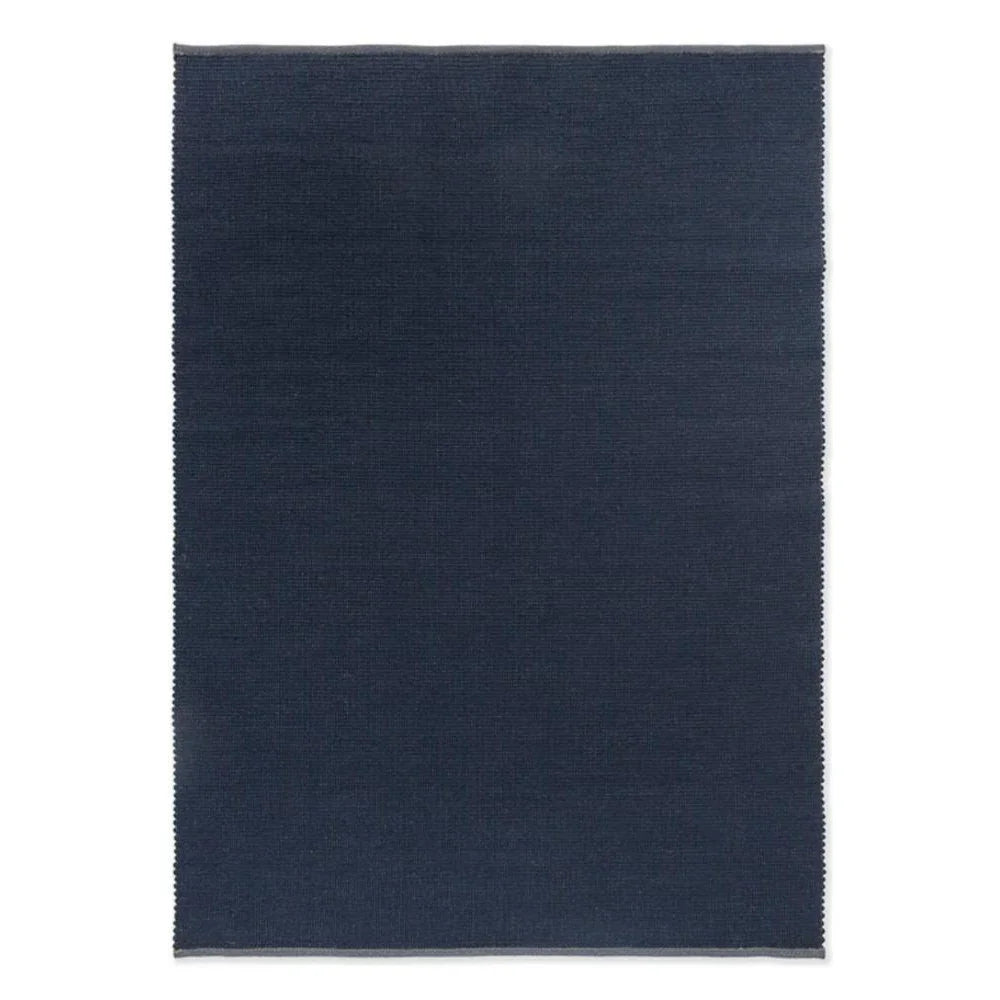 Brink & Campman Grid Ink Designer Rug featuring grid-inspired pattern in navy on white background, hand-tufted wool