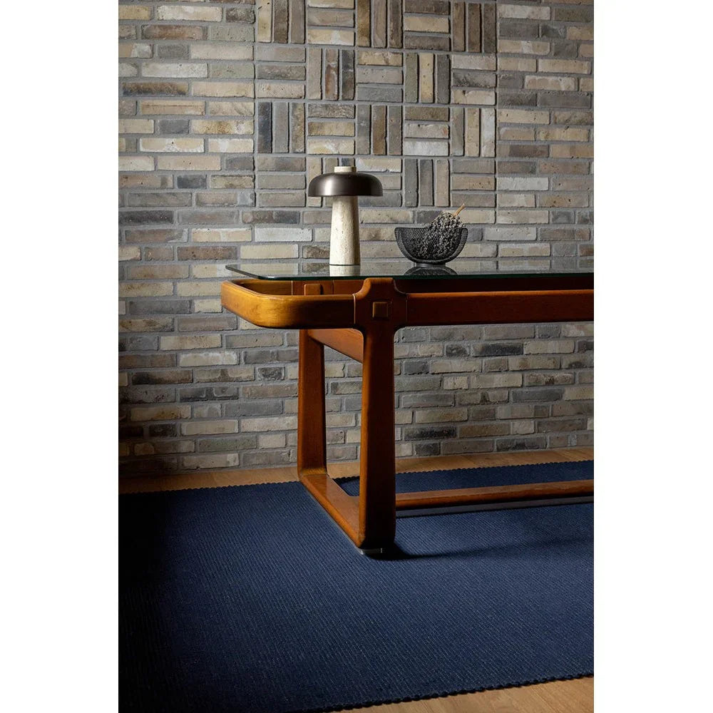 Brink & Campman Grid Ink Designer Rug featuring grid geometric pattern in navy blue on blue floor, power-loomed wool