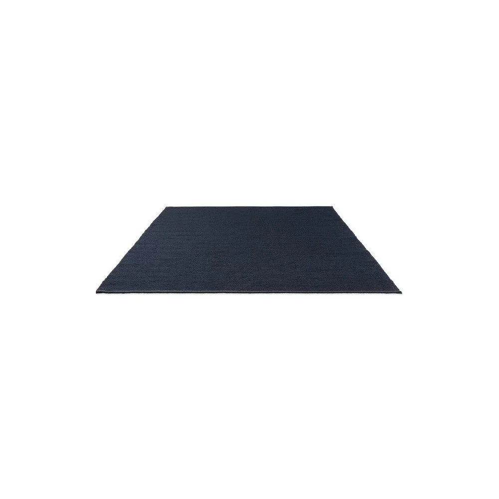 Brink & Campman Grid Ink Designer Rug featuring grid-style pattern in navy blue on white background, wool construction