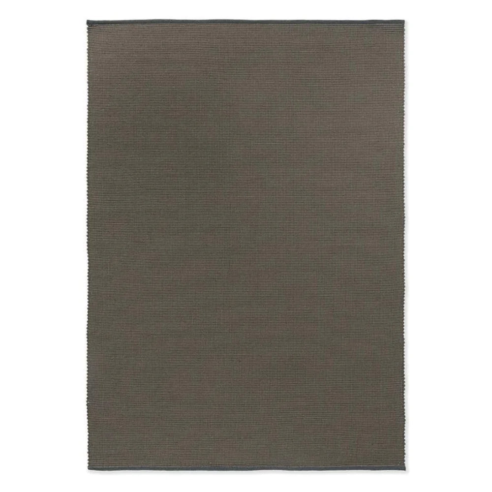 Brink & Campman Grid Stone Rug featuring subtle ribbed texture in taupe and charcoal on slate background, hand-tufted wool