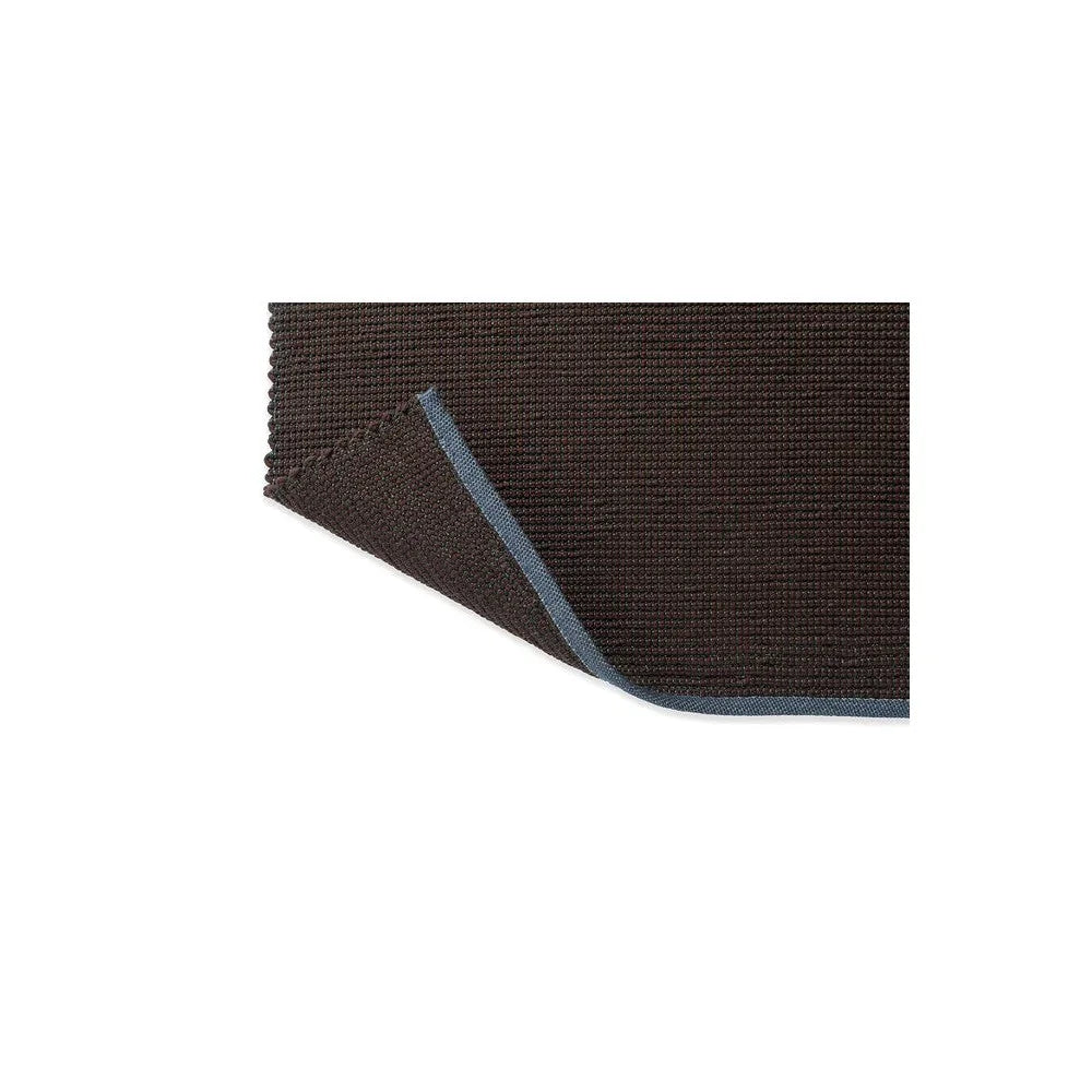 Brink & Campman Grid Cacao Rug featuring grid pattern in dark chocolate brown with blue edge on white background, hand-tufted wool