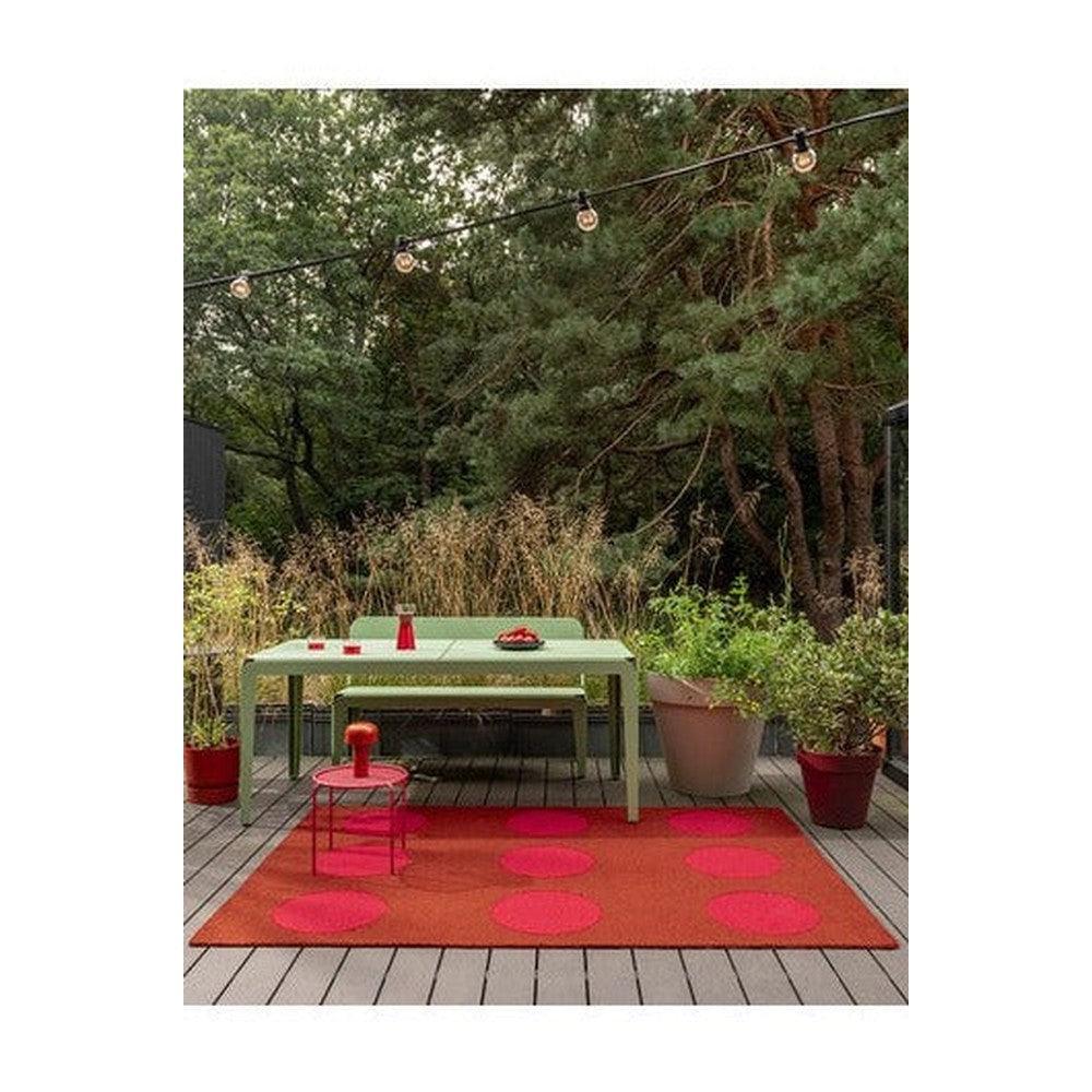 Brink & Campman Habitat Festival Dots Red Outdoor Rug featuring pink/orange dot pattern on grey deck, machine-made polypropylene