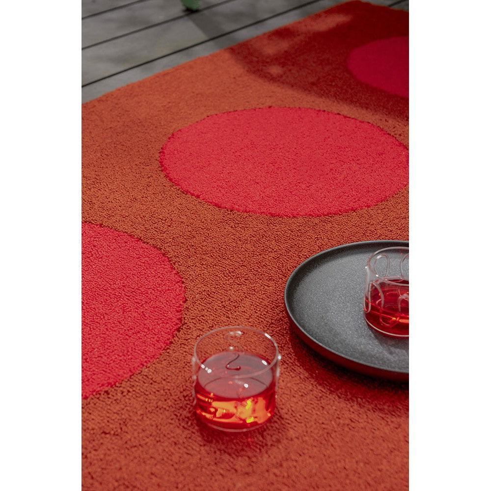Brink & Campman Habitat Festival Dots Red Outdoor Designer Rug featuring circular dot pattern in rich red, hot pink and orange on orange background, machine-made polypropylene
