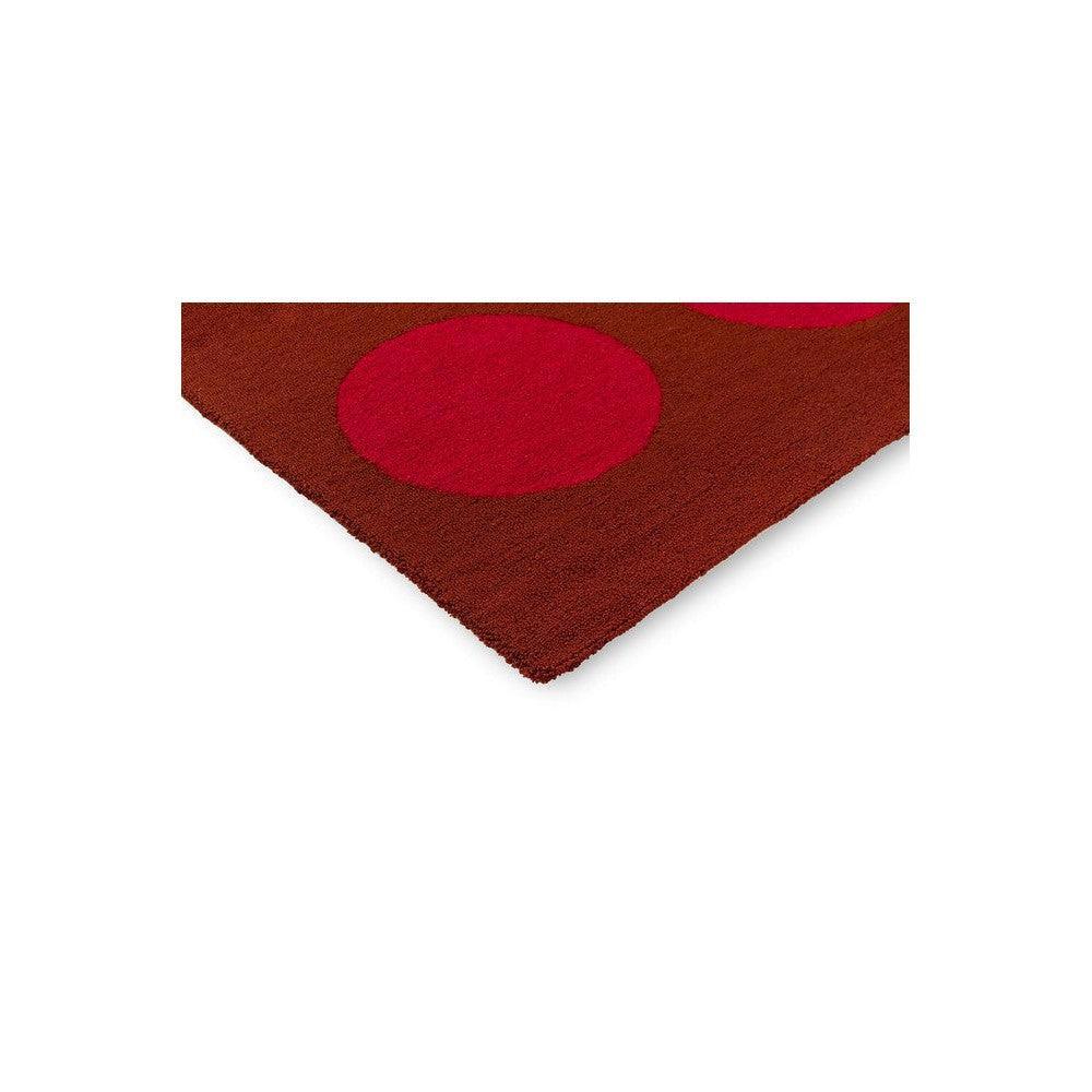 Brink & Campman Habitat Festival Dots outdoor rug featuring circular dot pattern in red and pink on deep brown background, machine-made polypropylene