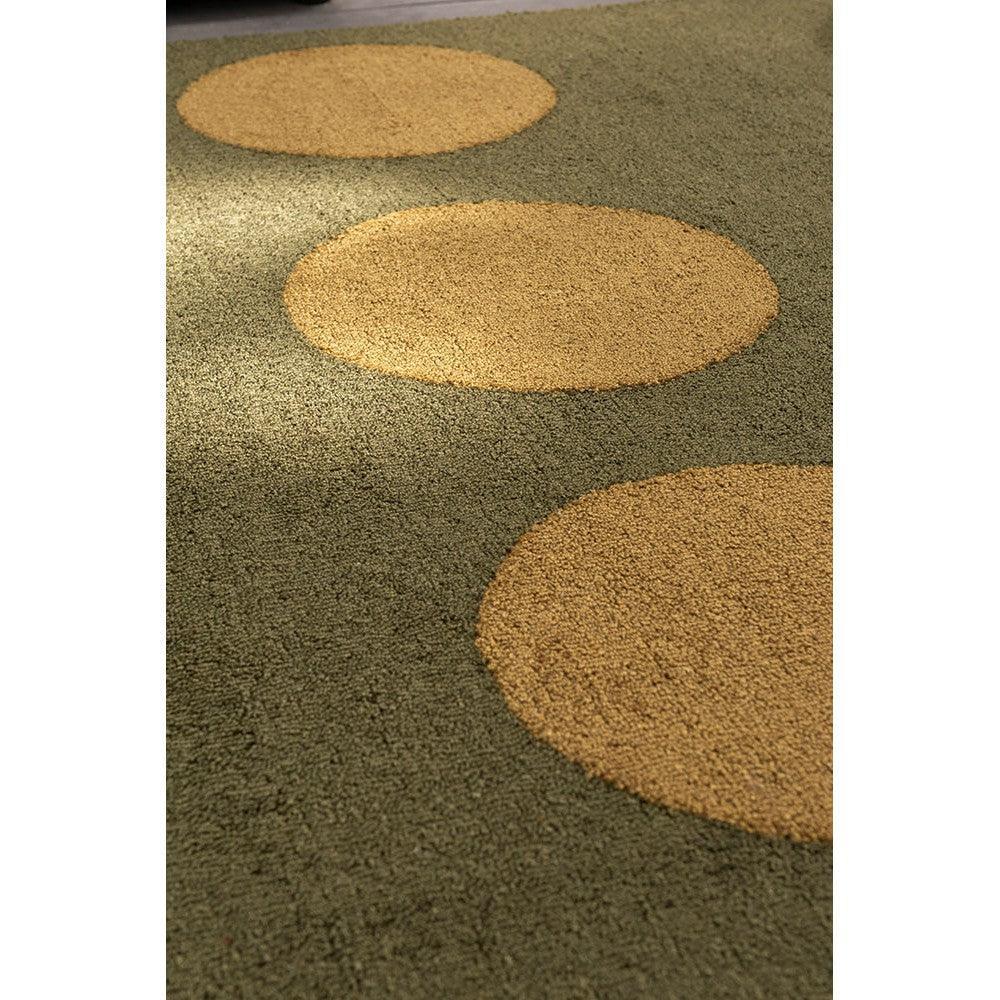 Brink & Campman Habitat Festival Dots olive green outdoor rug featuring circular mustard dots on olive background, power-loomed polypropylene