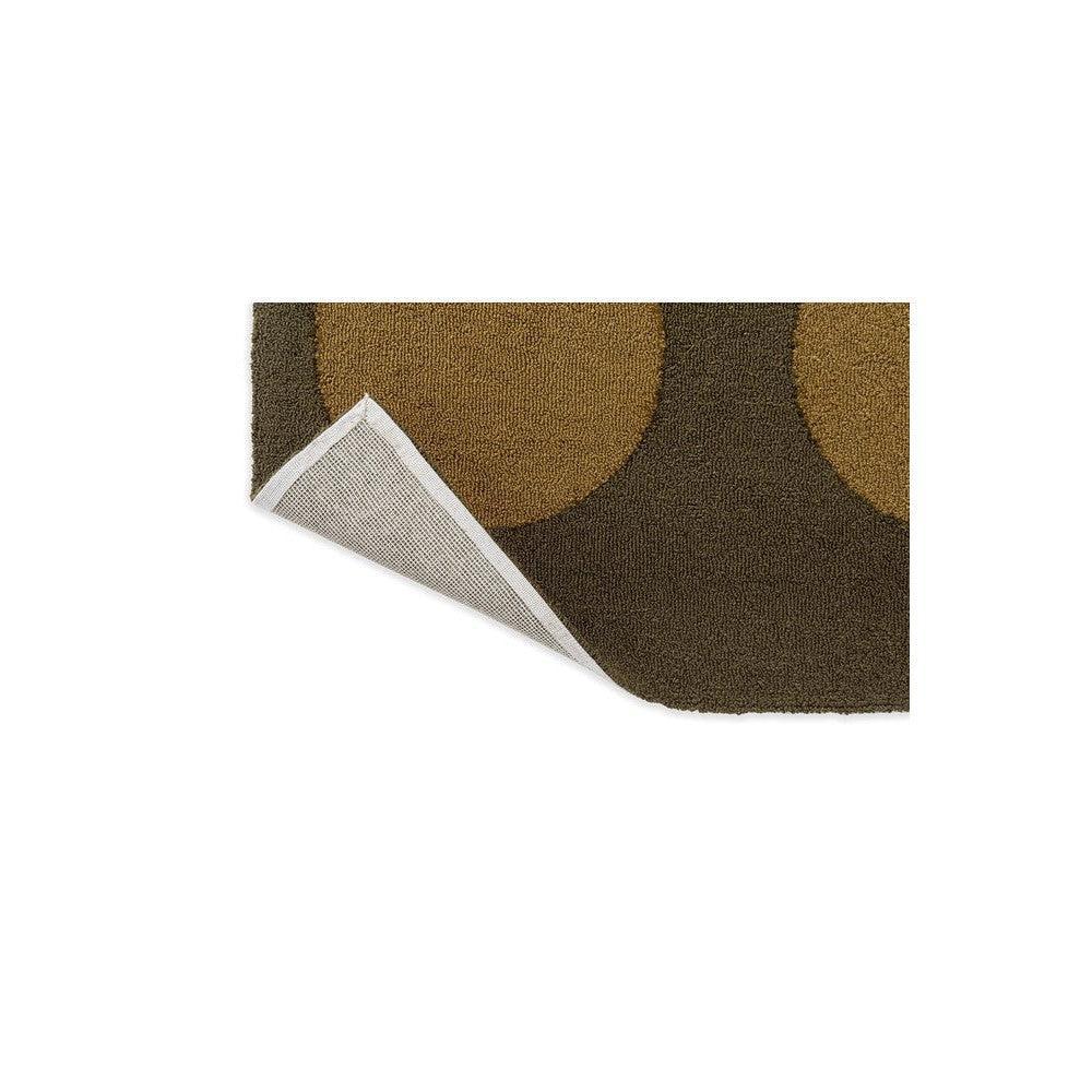 Brink & Campman Habitat Festival Dots Olive Green outdoor rug featuring circular olive, ochre and chocolate dots on brown background, power-loomed polypropylene