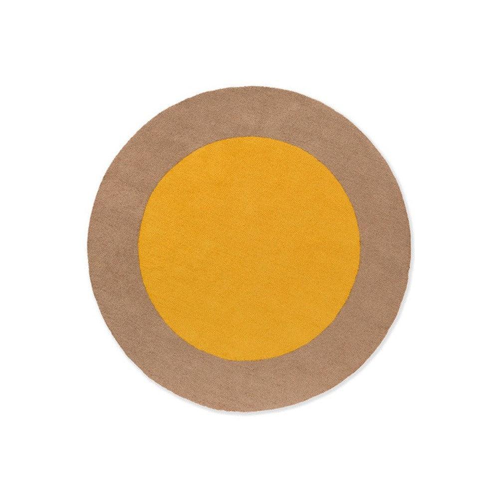 Brink & Campman Habitat Festival round rug featuring mustard yellow circle on beige outer ring, indoor/outdoor design