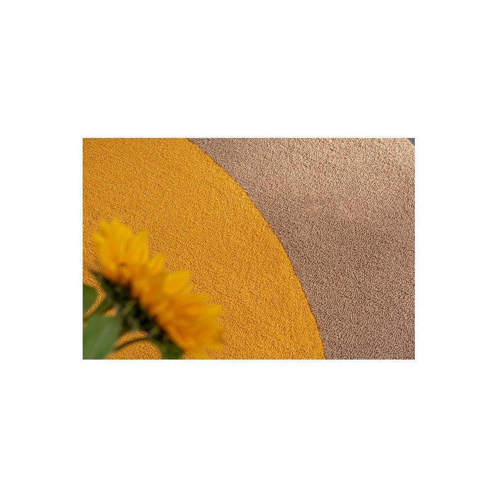 Brink & Campman Habitat Festival Round Yellow Outdoor Rug featuring a circular mustard sun motif on beige-brown textured background