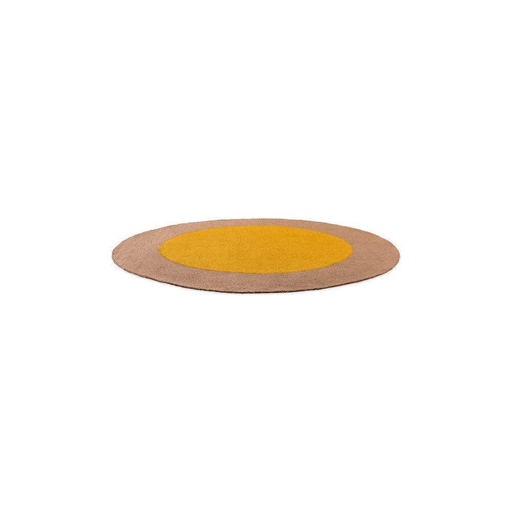 Brink & Campman Habitat Festival round rug featuring concentric mustard yellow and taupe rings on white background, machine-woven polypropylene