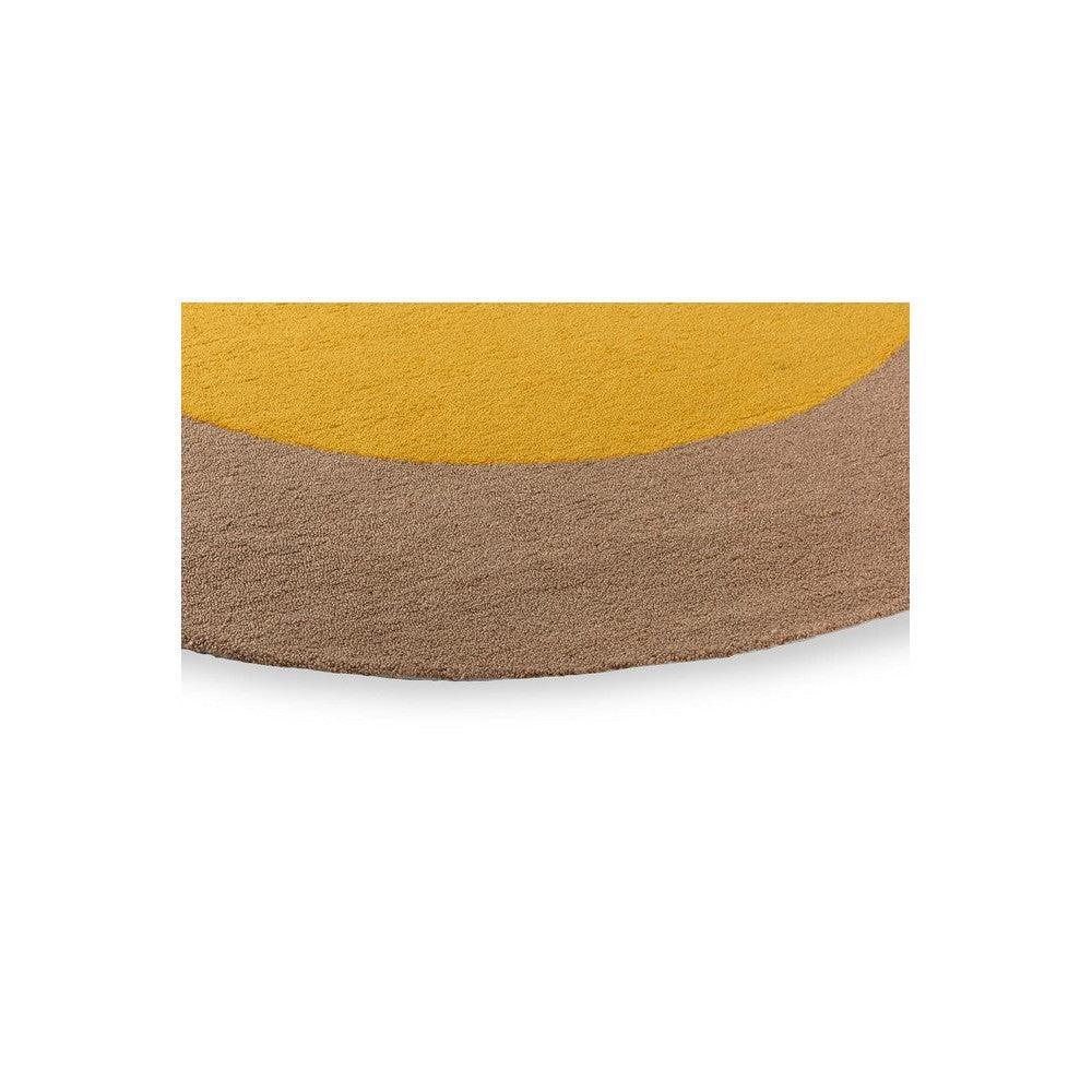 Brink & Campman Habitat Festival round outdoor rug with curved mustard yellow and tan bands on beige background