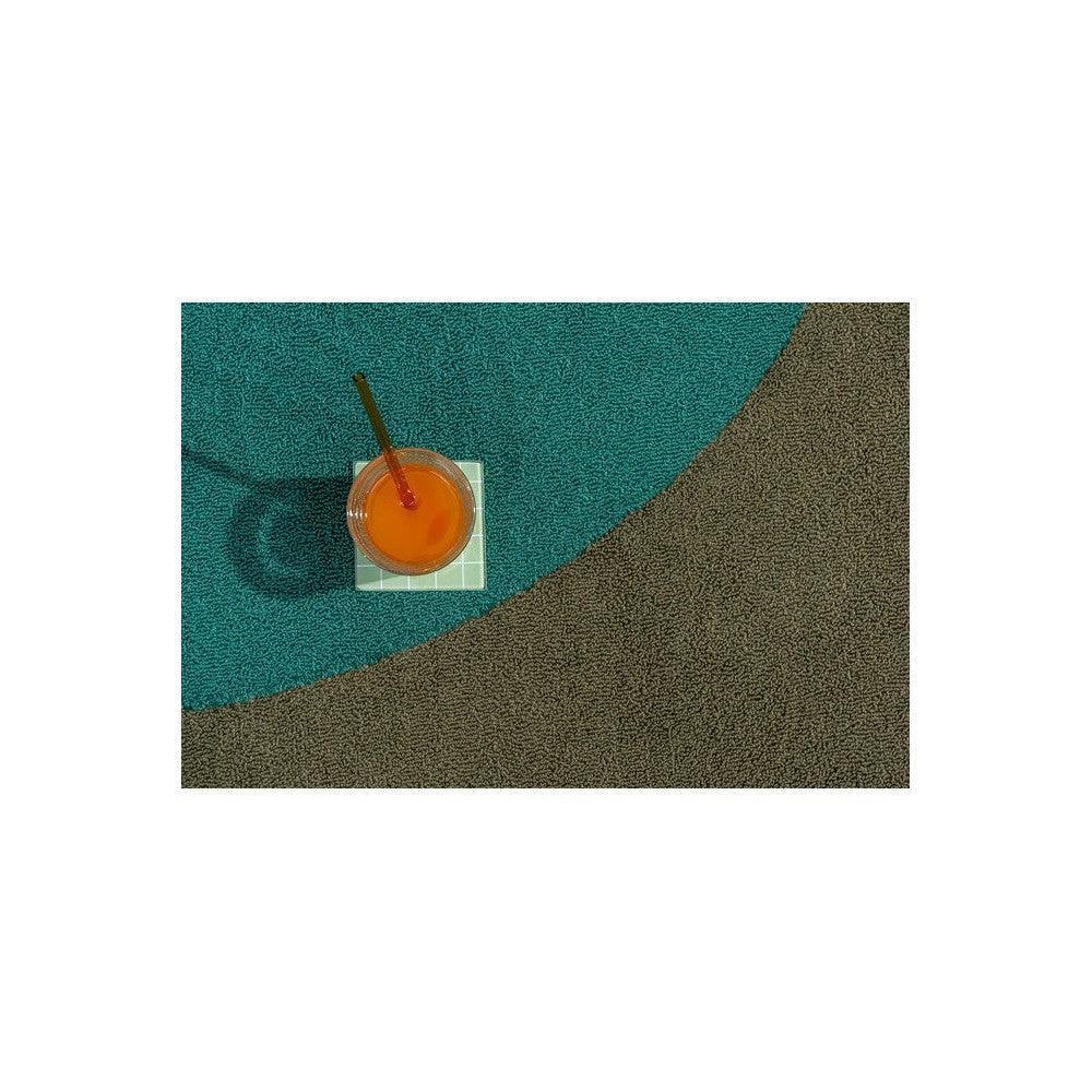 Brink & Campman Habitat Festival Round Aqua Outdoor Rug featuring abstract curved pattern in aqua teal and brown on white background, machine-woven polypropylene