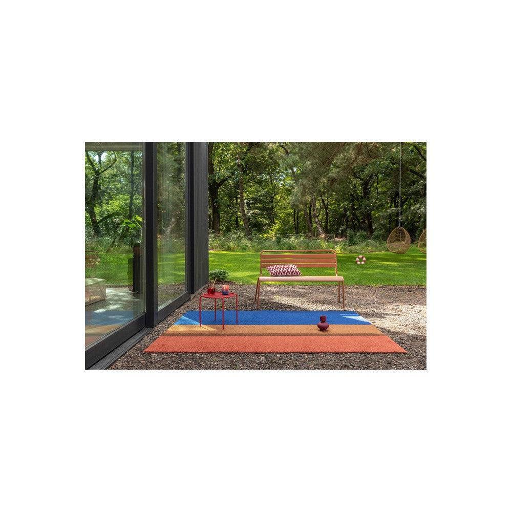Brink & Campman Habitat Festival Stripe Blue outdoor rug featuring cobalt blue, burnt orange and tan stripes on neutral ground, machine-woven polypropylene