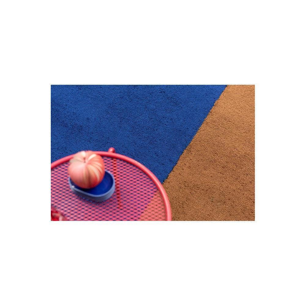 Brink & Campman Habitat Festival Stripe Blue outdoor rug featuring geometric stripes in royal blue, cobalt blue and tan on blue-tan background, power-loomed polypropylene