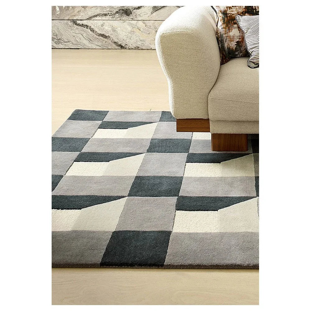 Harlequin Blocks Slate Designer Rug featuring geometric checkerboard pattern in slate, charcoal, grey and cream on beige background, machine-woven polyester