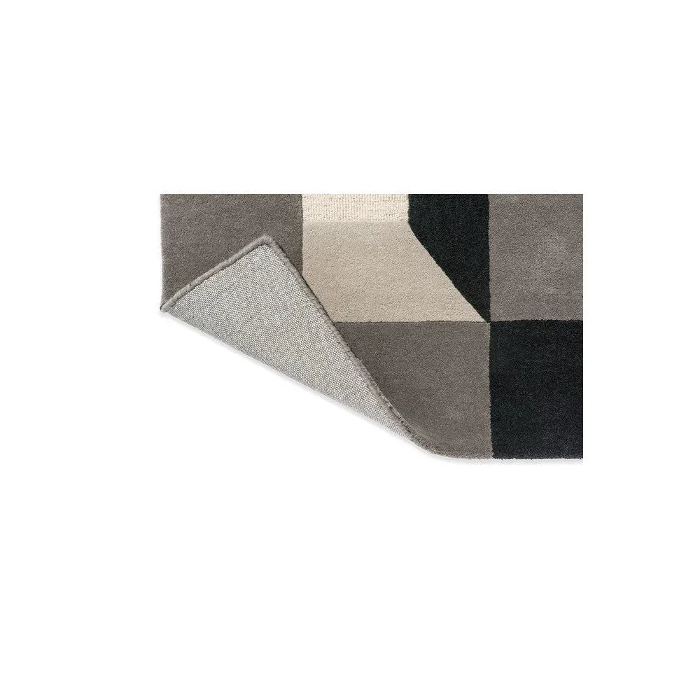 Harlequin Blocks Slate Designer Rug featuring geometric block pattern in slate, charcoal, beige and taupe on pale background, hand-tufted wool