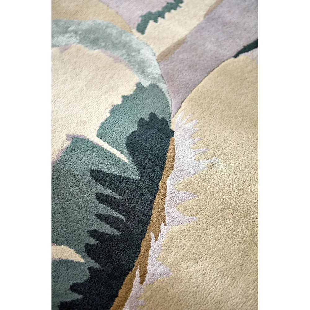 Harlequin Calathea Shiitake/Wild Water Rug featuring abstract leaf pattern in sage green, teal, navy, beige on cream, hand-tufted wool