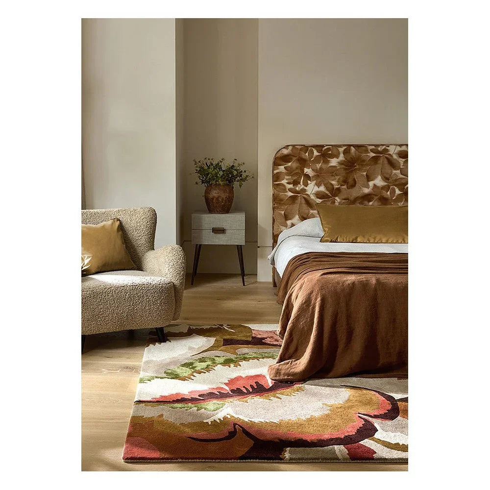 Harlequin Calathea Amber / Brazilian Rosewood Designer Rug featuring botanical floral pattern in amber, brown, cream and blush on cream ground, hand-tufted wool