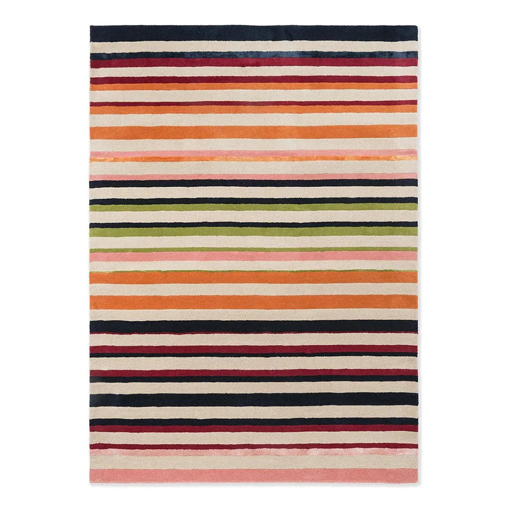 Harlequin Calla Pomegranate/Clementine Designer Rug featuring striped pattern in navy, cream, orange, pink on cream background, hand-tufted wool