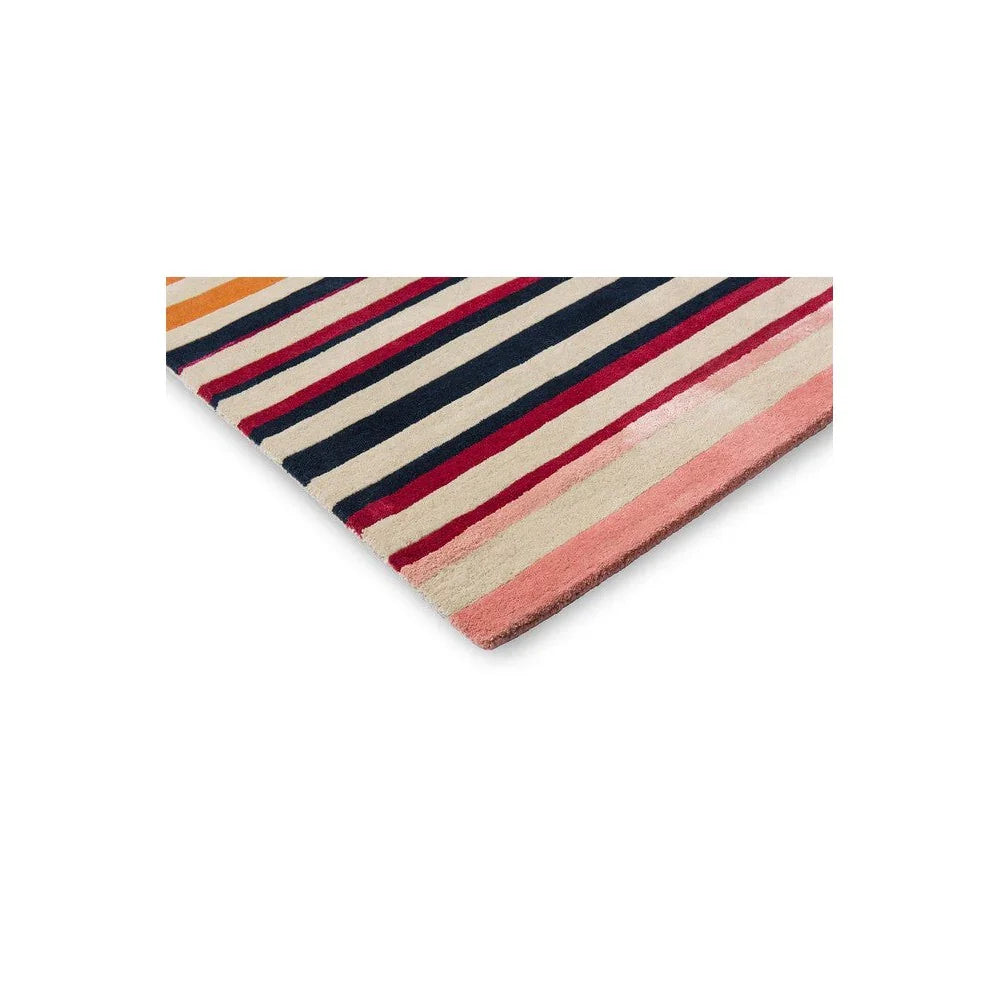 Harlequin Calla Designer Rug featuring striped pattern in navy, cream, red, peach and orange on beige background, hand-tufted wool
