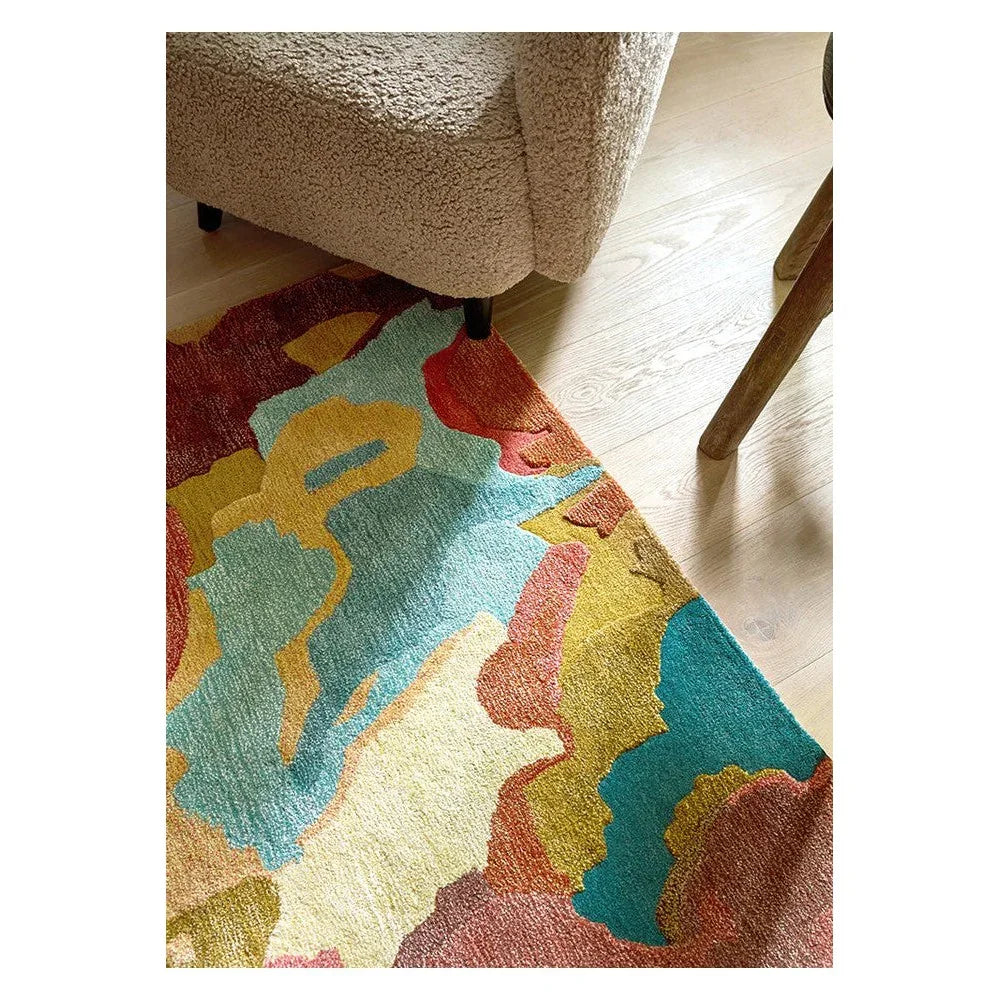 Harlequin Foresta rug featuring abstract floral pattern in rosewood, huckleberry, teal, ochre on cream background, hand-tufted wool