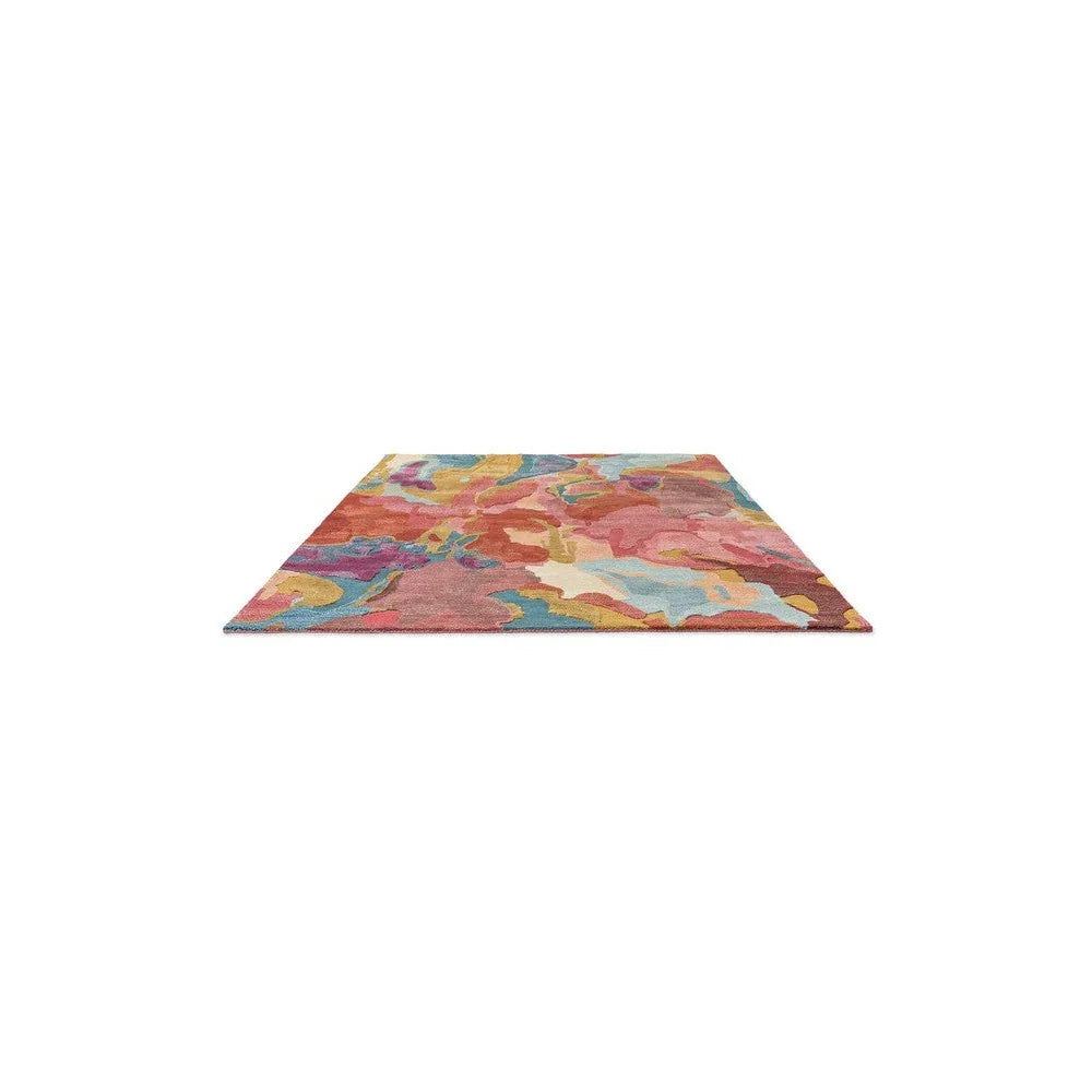 Harlequin Foresta rosewood/huckleberry Designer Rug featuring abstract floral pattern in rosewood, huckleberry, pink, purple, teal, yellow on pale background, hand-tufted wool