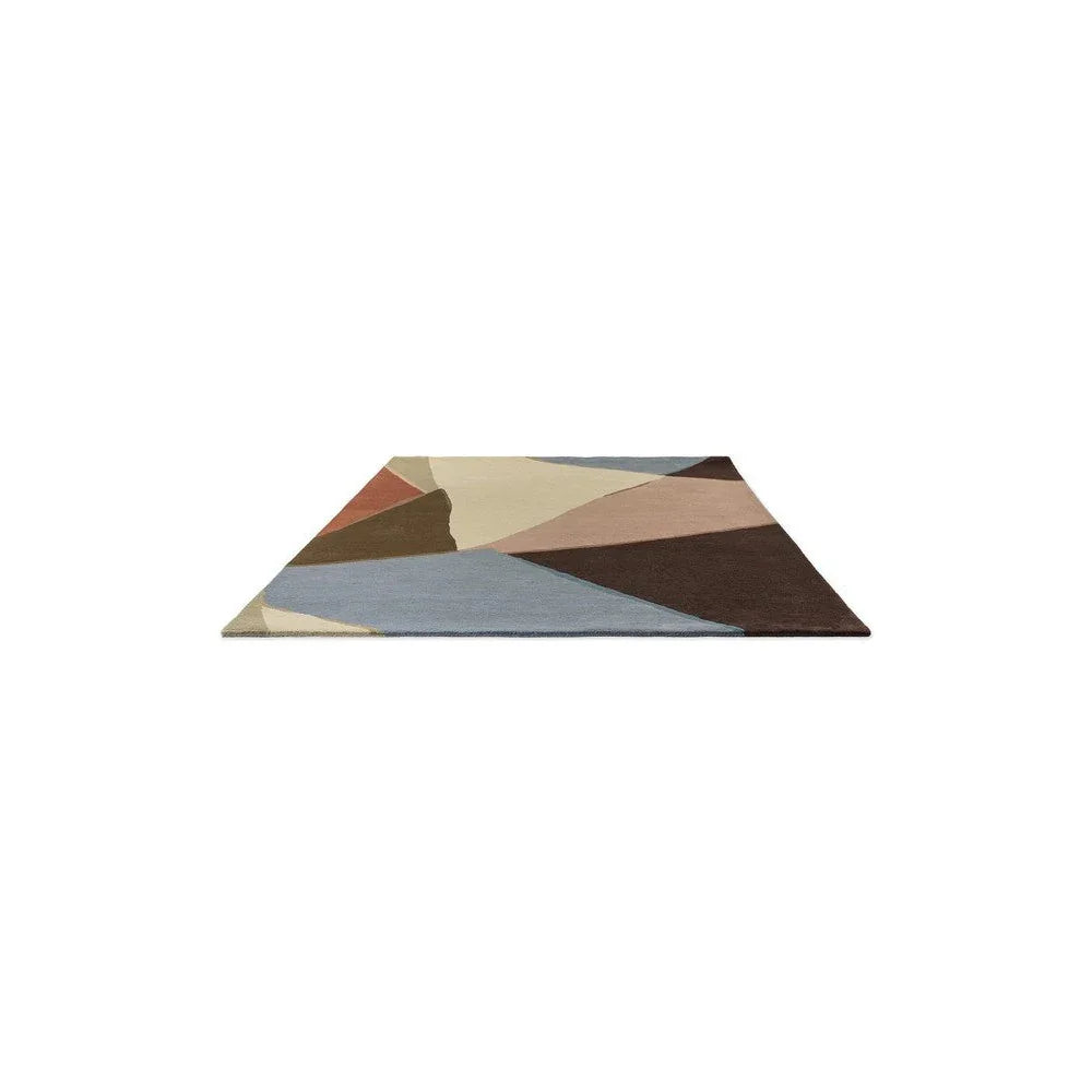 Harlequin Sumi Reflect rug featuring geometric patchwork in cornflower blue, cream, beige and brown on ivory background, hand-tufted wool