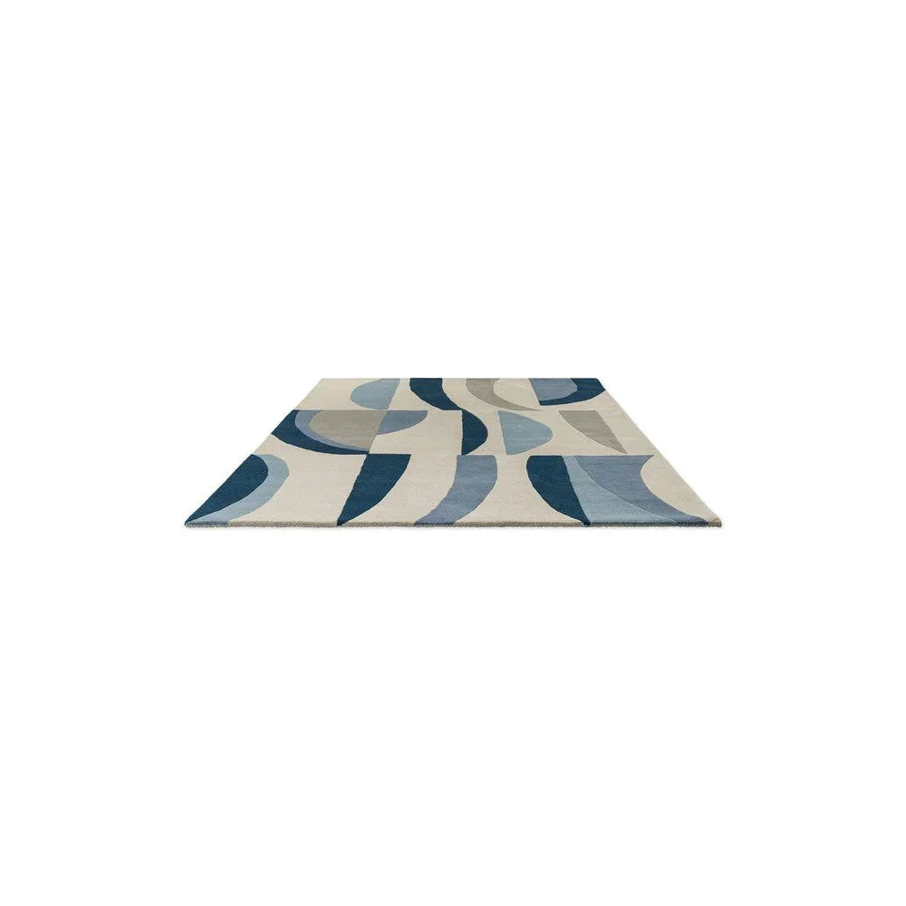 Harlequin Torillo Sky rug featuring abstract mid-century pattern in sky blue, cornflower blue, navy and beige on cream background, hand-tufted wool