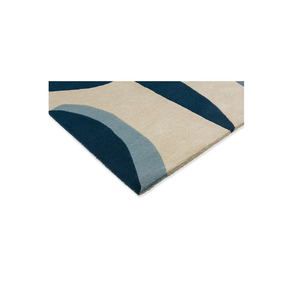 Harlequin Torillo Sky rug featuring mid-century geometric arc in cornflower blue, sky blue and navy on beige, hand-tufted wool