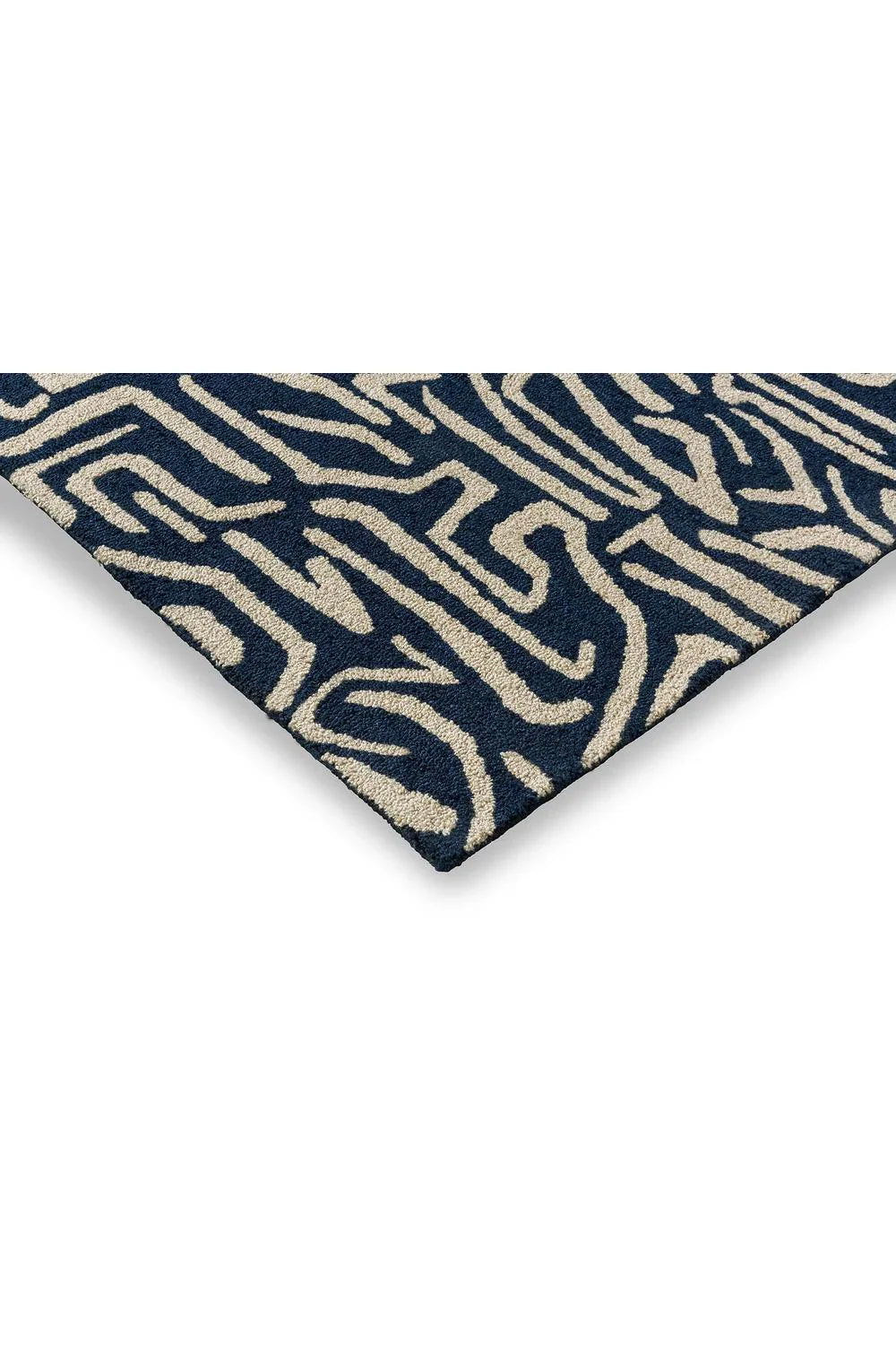 Harlequin Melodic Blue Designer Outdoor Rug featuring abstract zebra pattern in navy blue and beige on navy background, power-loomed polypropylene