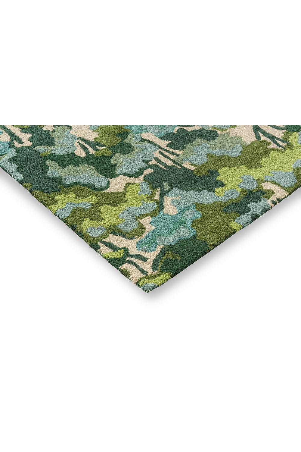 Harlequin Tree Tops Green Outdoor Rug featuring woodland camouflage in olive, emerald, sage, teal on beige background, outdoor polypropylene