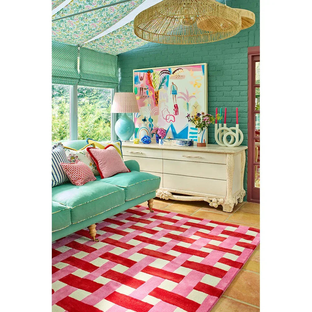 Sophie Robinson x Harlequin Basket Weave Coral/Rose Designer Rug featuring basket weave pattern in coral, pink, red, cream on pale beige background, hand-tufted wool