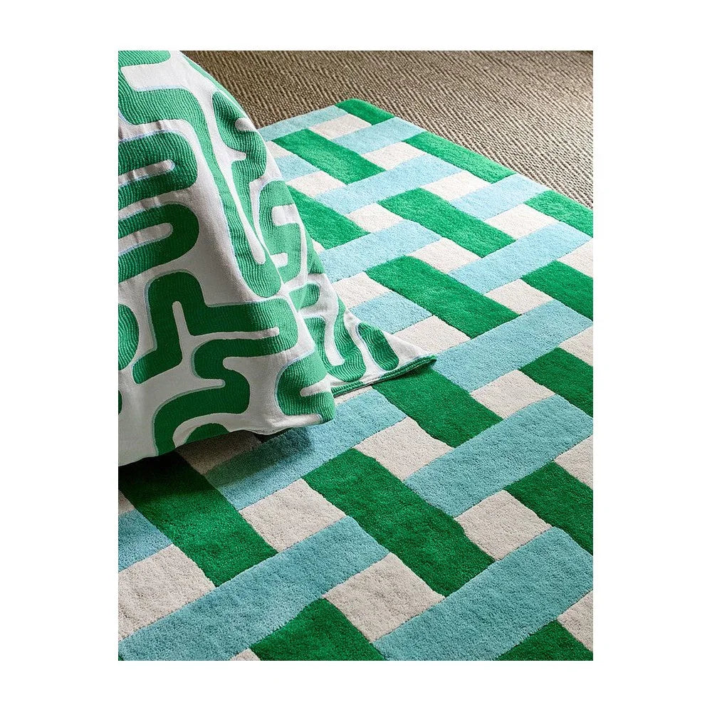 Sophie Robinson x Harlequin Basket Weave Rug featuring emerald green and aquamarine basket-woven blocks on pale beige background, woven rug