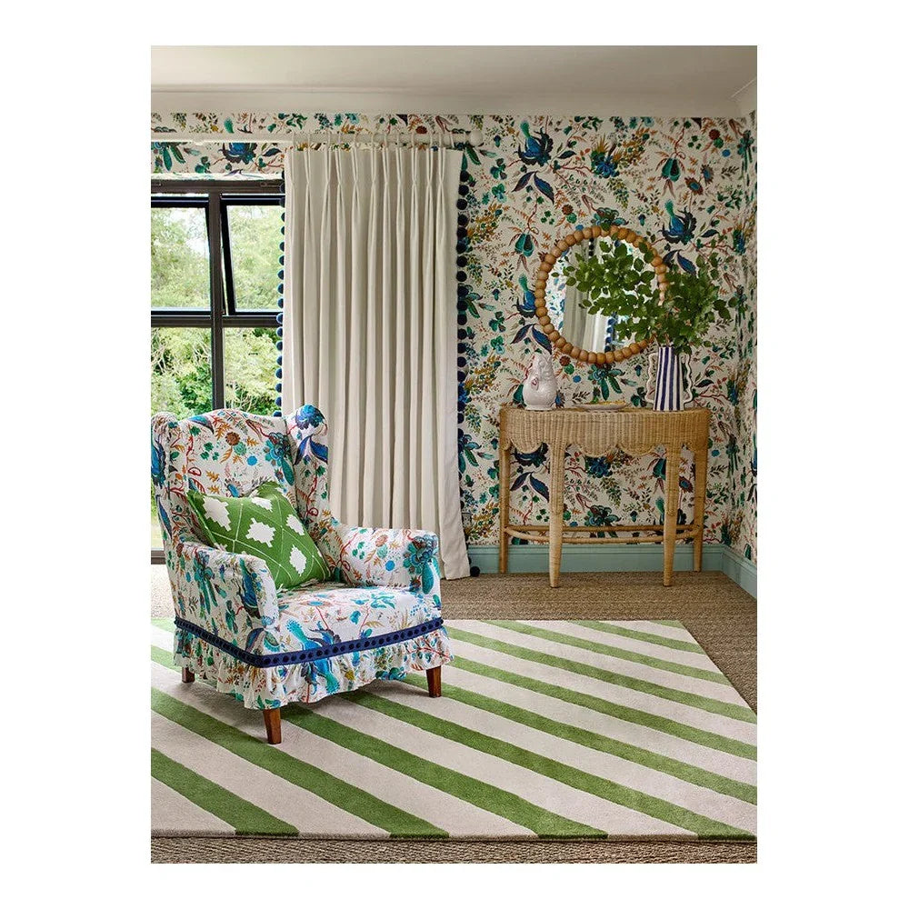 Sophie Robinson x Harlequin Paper Straw Peridot Designer Rug featuring striped lime green and white pattern on neutral floor, woven rug