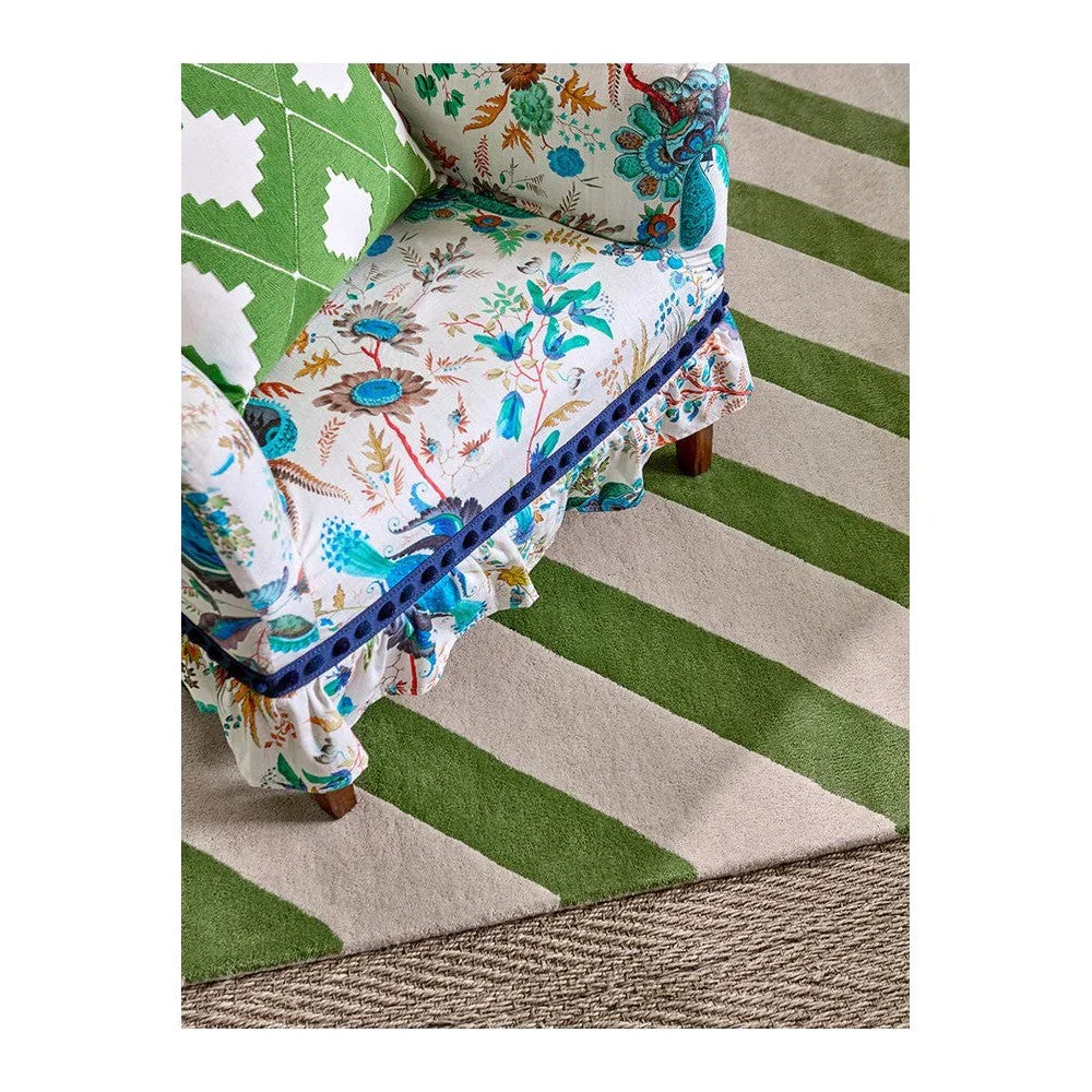 Sophie Robinson x Harlequin Paper Straw Peridot Rug featuring striped pattern in peridot green and cream on beige background, hand-tufted wool
