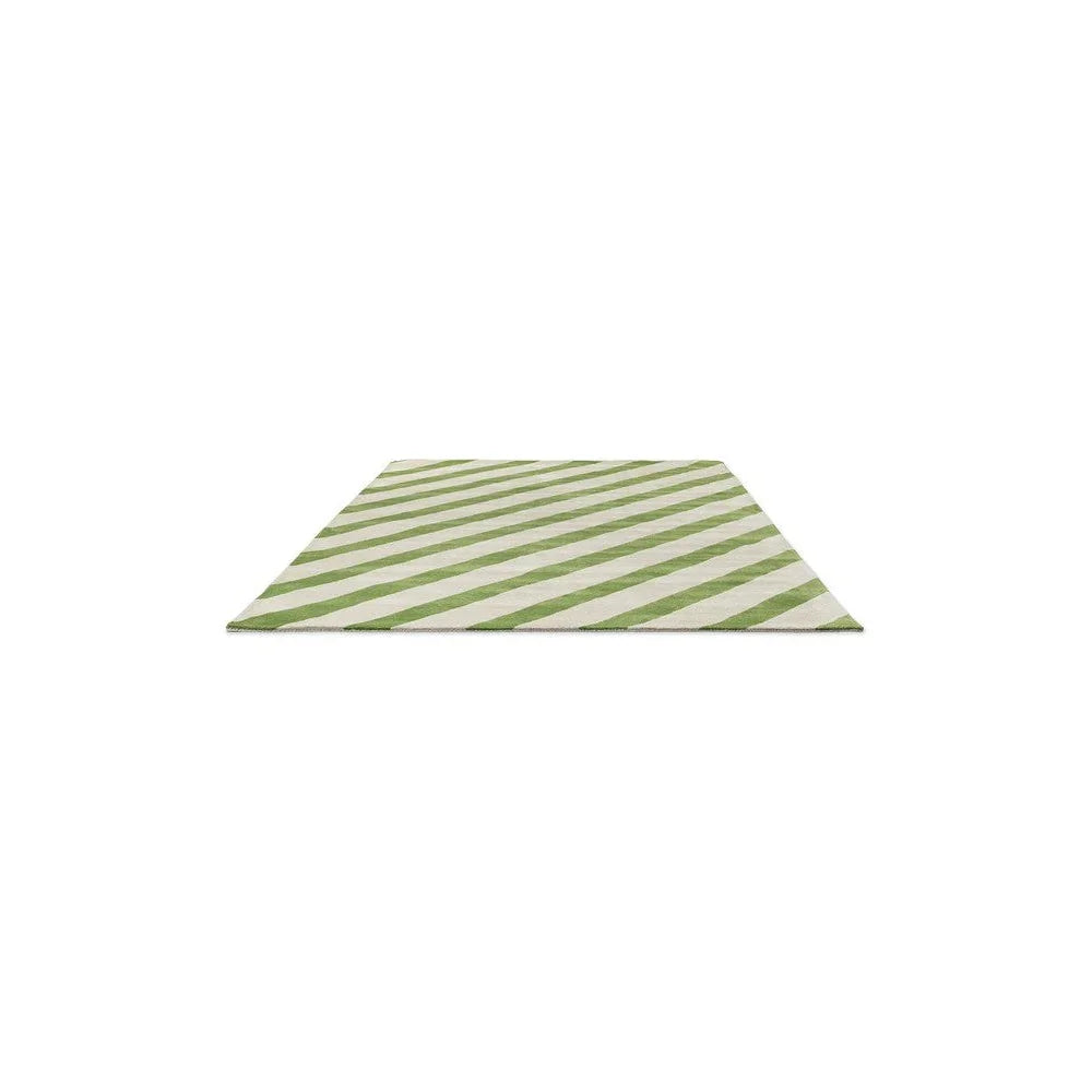 Sophie Robinson x Harlequin Paper Straw Peridot Rug featuring diagonal stripes in peridot green and ivory on cream, hand-tufted wool